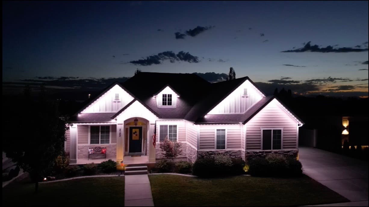 Premium permanent holiday lighting at dusk